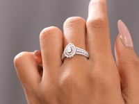 1.251 CT Pear, Round Cut Colorless Engagement Ring