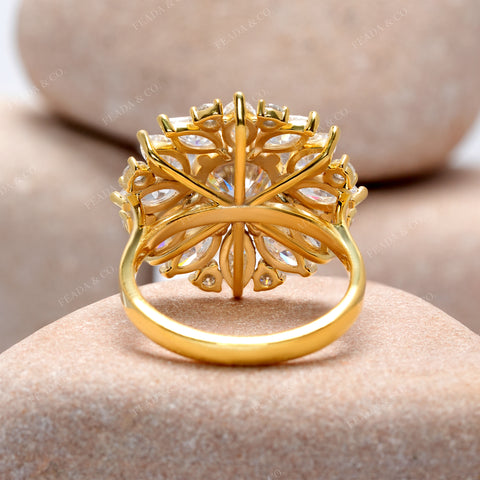 Gold ring with intricate design on a stone surface